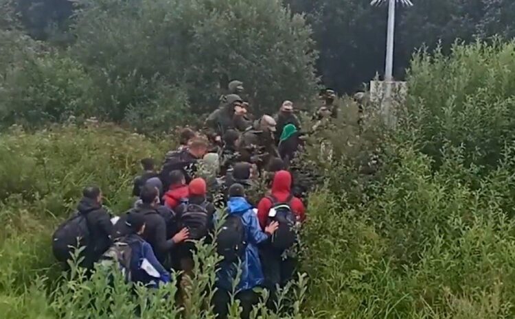 Lithuania says Belarus officers illegally pushed migrants over border