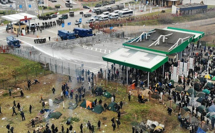 Poland border crisis: Migrants tear-gassed trying to cross from Belarus